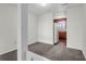 Bright living room featuring neutral carpet and an opening to the kitchen at 4722 Whitwil Blvd, North Charleston, SC 29418