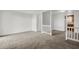 Bright open living room featuring neutral carpet and an opening to the kitchen at 4722 Whitwil Blvd, North Charleston, SC 29418