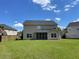 Spacious backyard with a well-maintained lawn and a screened-in porch at 4804 Coopers Ct, Summerville, SC 29485