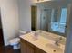 Bathroom with dual sinks, a large mirror, toilet, and walk in shower at 4804 Coopers Ct, Summerville, SC 29485