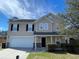 Charming two-story home with a well-manicured lawn and an attached two-car garage at 4804 Coopers Ct, Summerville, SC 29485
