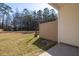 A spacious backyard features green grass and a privacy fence, offering a serene outdoor space at 5146 Park Creek Ave, North Charleston, SC 29418