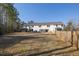 Vast backyard with a spacious lawn and rear view of home, ideal for outdoor activities and enjoying the nature at 5146 Park Creek Ave, North Charleston, SC 29418