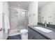 Modern bathroom features a glass-enclosed shower and a stylish vanity with a gray countertop at 5146 Park Creek Ave, North Charleston, SC 29418