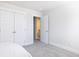 Bedroom with closet, doorway to bathroom, carpet flooring, and natural light at 5146 Park Creek Ave, North Charleston, SC 29418