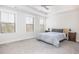 Bedroom with carpet flooring, a tray ceiling, and natural light from the windows at 5146 Park Creek Ave, North Charleston, SC 29418