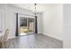 Bright dining area with slider doors to the outside and gray plank flooring at 5146 Park Creek Ave, North Charleston, SC 29418