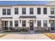 Charming townhouse with stone accents, light trim, and black door awning at 5146 Park Creek Ave, North Charleston, SC 29418