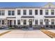 Charming townhouse with stone accents, light trim, and black door awning at 5146 Park Creek Ave, North Charleston, SC 29418