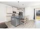 Modern kitchen featuring white cabinets, gray island, and stainless steel appliances at 5146 Park Creek Ave, North Charleston, SC 29418