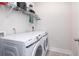 Laundry room featuring a large washer and dryer with shelving at 5146 Park Creek Ave, North Charleston, SC 29418