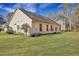 Home featuring a large, grassy backyard with a patio area at 5420 Percival Ln, North Charleston, SC 29420