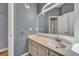 Neutral bathroom featuring a white vanity and a large framed mirror at 5420 Percival Ln, North Charleston, SC 29420