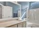 Hall bathroom features a vanity and shower-tub combo at 5420 Percival Ln, North Charleston, SC 29420