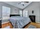 Spacious bedroom features wood floors, high ceilings, and a ceiling fan at 5420 Percival Ln, North Charleston, SC 29420