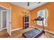 Bedroom featuring a treadmill, ceiling fan, and light-filled window at 5420 Percival Ln, North Charleston, SC 29420