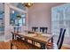 Dining room with hardwood floors, light fixture, view of the kitchen, and natural lighting at 5420 Percival Ln, North Charleston, SC 29420