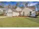 Charming home featuring a well-manicured lawn and mature landscaping at 5420 Percival Ln, North Charleston, SC 29420