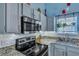 Well-appointed kitchen featuring stainless appliances, granite counters, and under-cabinet lighting at 5420 Percival Ln, North Charleston, SC 29420