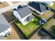 Aerial view of a two-story home with a fenced yard, shed, and trampoline at 615 Ravens Wood Rd, Summerville, SC 29486