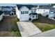 An aerial view of a two-story home with a long driveway and neat landscaping at 615 Ravens Wood Rd, Summerville, SC 29486
