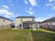 Fenced in back yard featuring a screened in porch, patio, and lawn at 615 Ravens Wood Rd, Summerville, SC 29486