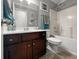 Bathroom features a vanity with dark wood cabinets, a white countertop, and a shower-tub combination at 615 Ravens Wood Rd, Summerville, SC 29486