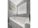 Bright bathroom featuring a large tub under a window with blinds at 615 Ravens Wood Rd, Summerville, SC 29486