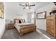 Bedroom features a bed with a wooden frame, wooden nightstand, a large mirror, and carpet flooring at 615 Ravens Wood Rd, Summerville, SC 29486