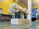 Close-up of mason jar flower arrangement sitting on an accent table at 615 Ravens Wood Rd, Summerville, SC 29486