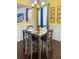 Dining area with modern table and chairs, wainscoting, and decorative wall art at 615 Ravens Wood Rd, Summerville, SC 29486