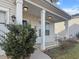 A close-up of a charming front porch with white railings and neat landscaping at 615 Ravens Wood Rd, Summerville, SC 29486