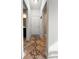 Hallway features tile flooring, neutral walls, and access to multiple rooms and a closet at 615 Ravens Wood Rd, Summerville, SC 29486