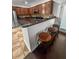 The eat-in kitchen features stainless appliances, dark cabinetry, and breakfast bar seating at 615 Ravens Wood Rd, Summerville, SC 29486