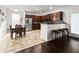 Eat-in kitchen featuring stainless appliances, dark cabinets, and decorative tile floor and backsplash at 615 Ravens Wood Rd, Summerville, SC 29486