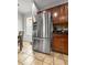 An eat-in kitchen featuring stainless steel refrigerator and dark cabinetry at 615 Ravens Wood Rd, Summerville, SC 29486
