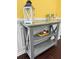 Entryway with rustic console table and decorative accents against a vibrant yellow wall at 615 Ravens Wood Rd, Summerville, SC 29486
