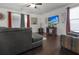 Cozy living room with a sectional couch, ceiling fan, and mounted television at 615 Ravens Wood Rd, Summerville, SC 29486