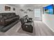 Living room features a tiered seating area, leather sofas, wall decor, carpet flooring and a television at 615 Ravens Wood Rd, Summerville, SC 29486