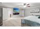 Bedroom featuring a large bed, TV, ceiling fan, and ensuite bathroom at 615 Ravens Wood Rd, Summerville, SC 29486