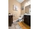 A neutral toned powder room featuring a toilet, sink and vanity at 615 Ravens Wood Rd, Summerville, SC 29486