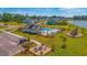 Aerial view of community pool, fire pit, playground, and houses in the neighborhood at 625 Sienna Way, Summerville, SC 29486