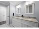 Bathroom with double sink vanity, framed mirrors, and modern fixtures at 625 Sienna Way, Summerville, SC 29486
