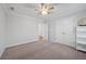 Neutral bedroom with standard closet, view to hallway and ceiling fan at 625 Sienna Way, Summerville, SC 29486