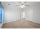 Neutral bedroom with standard closet, view to hallway and ceiling fan at 625 Sienna Way, Summerville, SC 29486