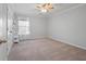 Neutral bedroom with standard closet, window and ceiling fan at 625 Sienna Way, Summerville, SC 29486