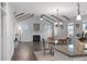 Cozy dining area with fireplace, cathedral ceiling and beams, and hardwood floors at 625 Sienna Way, Summerville, SC 29486