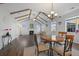 Cozy dining area with fireplace, cathedral ceiling and beams, and hardwood floors at 625 Sienna Way, Summerville, SC 29486