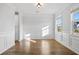 Spacious dining room with hardwood floors, white wainscoting, and natural light at 625 Sienna Way, Summerville, SC 29486