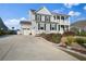 Charming home with a well-manicured lawn and long driveway with space for multiple cars at 625 Sienna Way, Summerville, SC 29486